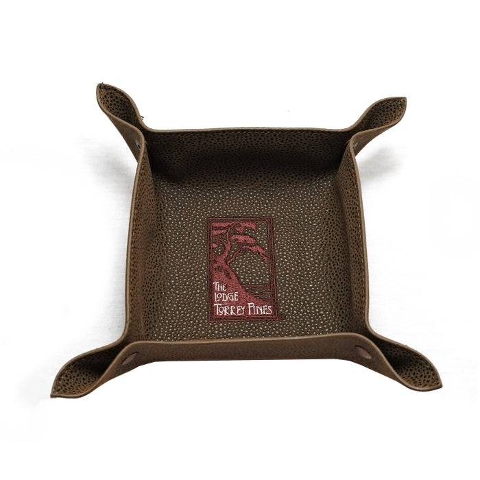 Top view of brown valet tray in faux suede with The Lodge at Torrey Pines logo