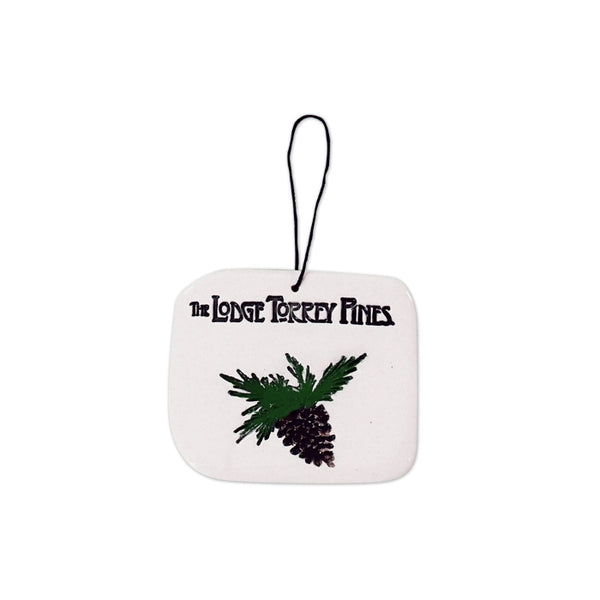 Ceramic tile ornament featuring a pine cone and The Lodge Torrey Pines logo